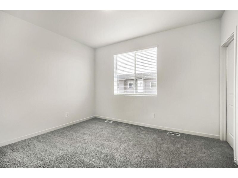 Spacious, unfurnished interior of a new home in Riano Ridge, Loveland (Image 12).