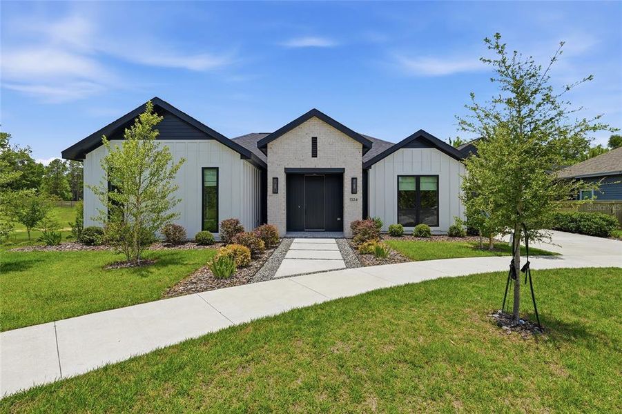 Front exterior of a new home in , Gainesville, FL, highlighting curb appeal (Image 22). Front exterior of a new home in , Gainesville, FL, highlighting curb appeal (Image 22).