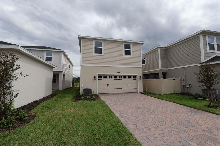 Exterior details and patio area of a home in Center Lake on the Park, St. Cloud (Image 31).