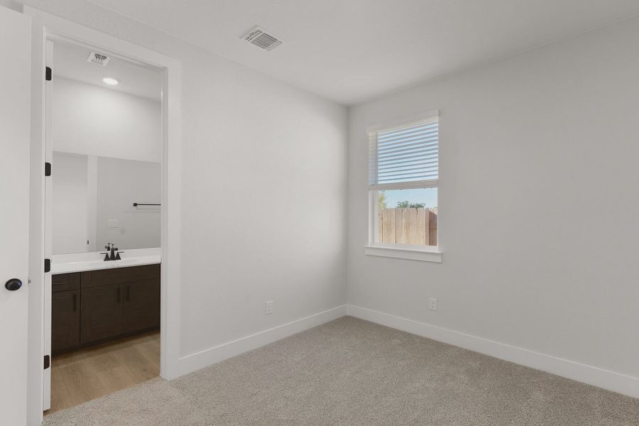 Representative unfurnished interior of a home built from the Barron by Chesmar Homes in Lariat, Liberty Hill (Image 23).