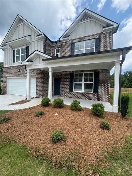 Front exterior of a home in the Kingsmere Estates community, located in Loganville, GA (Image 9).