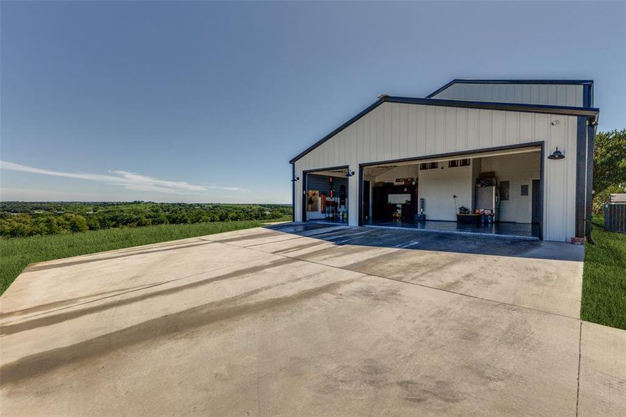 Three Car Garage with professional Floor coating and Wall Rack System Three Car Garage with professional Floor coating and Wall Rack System