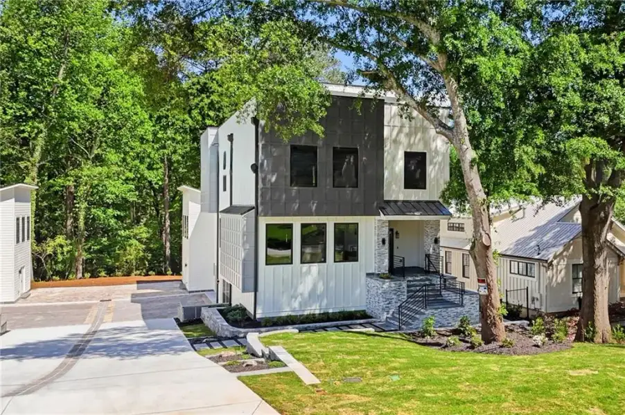 Front exterior of a new home in , Roswell, GA, highlighting curb appeal (Image 29).