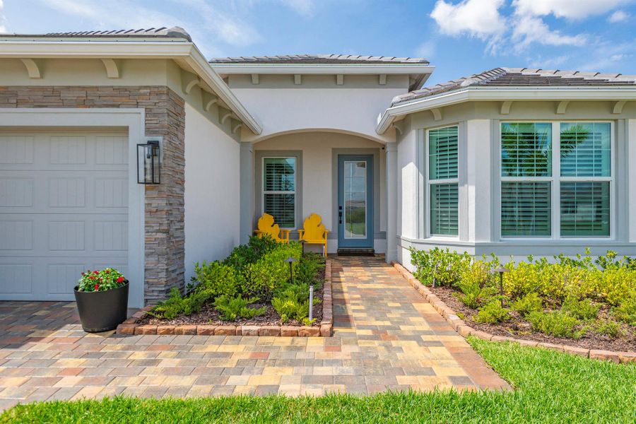 Front exterior of a new home in Del Webb Tradition, Port St. Lucie, FL, highlighting curb appeal (Image 21). Front exterior of a new home in Del Webb Tradition, Port St. Lucie, FL, highlighting curb appeal (Image 21).