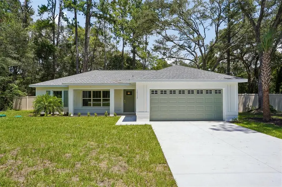Front exterior of a new home in , Citrus Springs, FL, highlighting curb appeal (Image 28). Front exterior of a new home in , Citrus Springs, FL, highlighting curb appeal (Image 28).