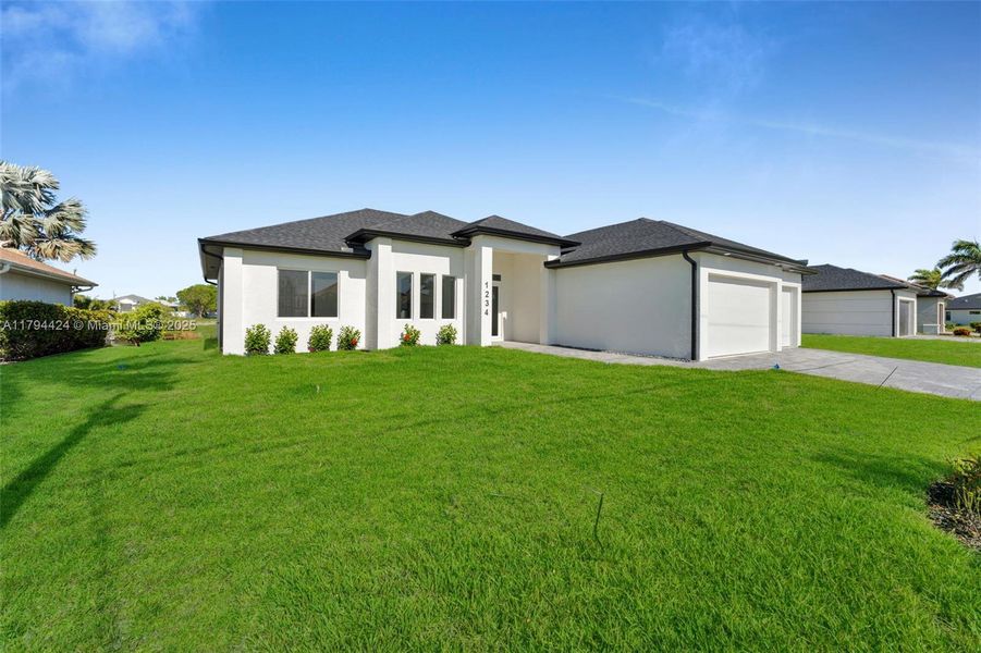 Front exterior of a new home in , Cape Coral, FL, highlighting curb appeal (Image 22). Front exterior of a new home in , Cape Coral, FL, highlighting curb appeal (Image 22).