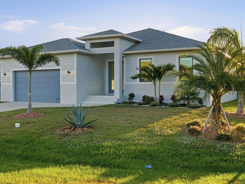 Front exterior of a new home in , Rotonda West, FL, highlighting curb appeal (Image 1).
