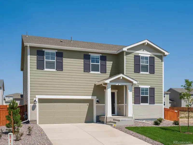 Front exterior of a new home in Hidden Valley Farm, Severance, CO, highlighting curb appeal (Image 1).