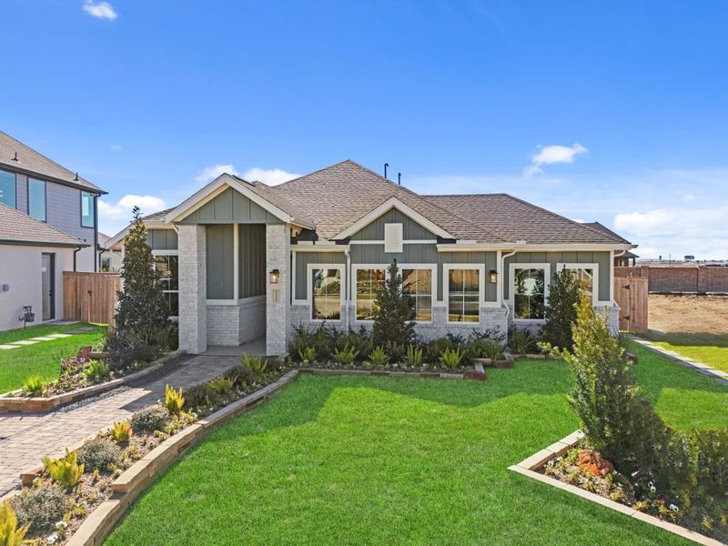 Representative exterior photo of a completed home built from the Aubrey by Chesmar Homes in Sienna, Missouri City, TX (Image 26).
