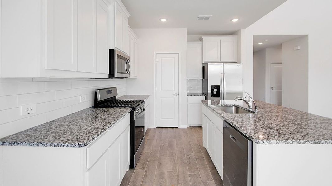 Furnished interior view inside a new home in Prairie Oaks, Oak Point (Image 6).