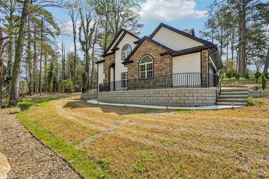 Front exterior of a new home in , Grayson, GA, highlighting curb appeal (Image 23).