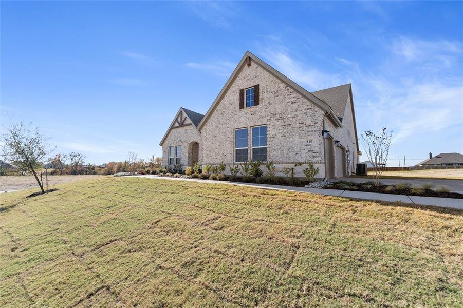 Front exterior of a new home in Creekview Addition, Van Alstyne, TX, highlighting curb appeal (Image 21).