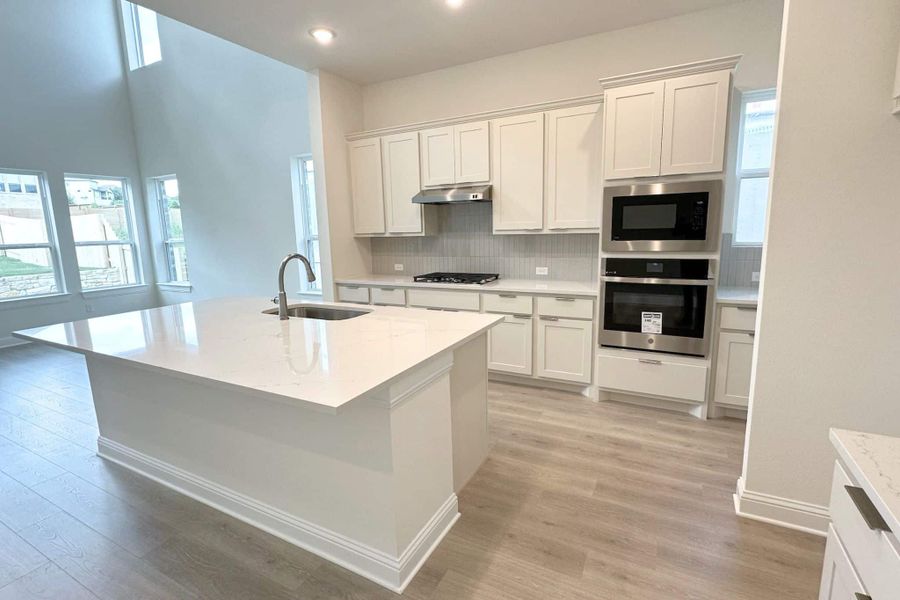 Furnished interior view inside a new home in Bluffview Reserve, Leander (Image 9).