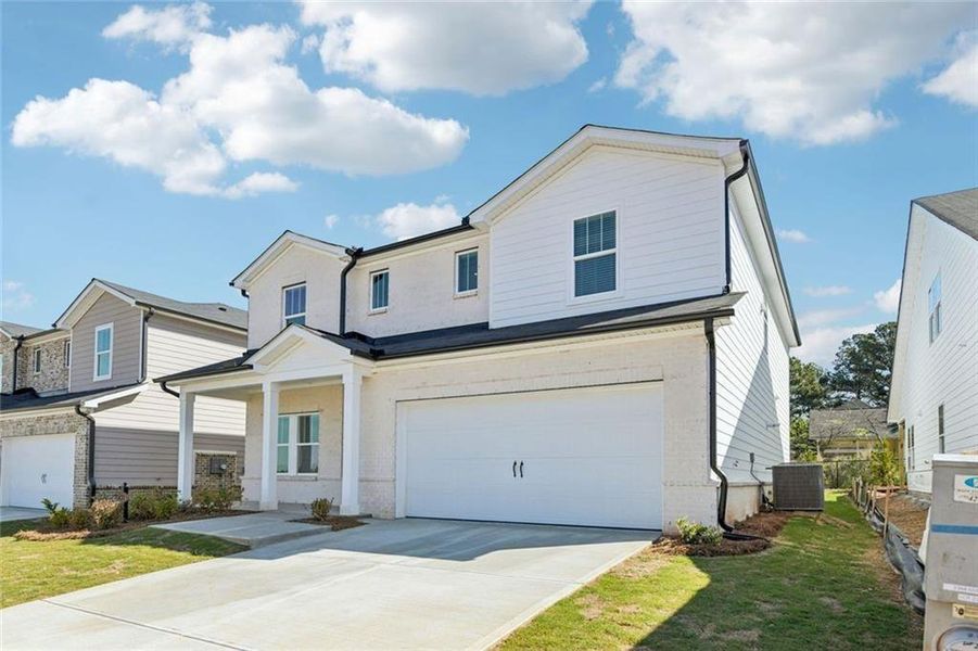 Front exterior of a new home in Martin Springs - Estate Series, Lawrenceville, GA, highlighting curb appeal (Image 1). Front exterior of a new home in Martin Springs - Estate Series, Lawrenceville, GA, highlighting curb appeal (Image 1).