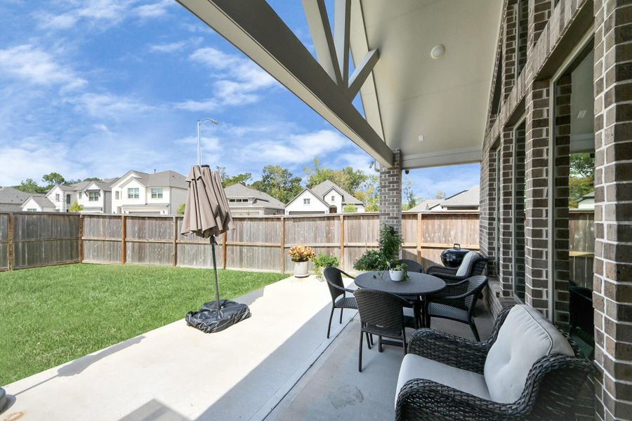 Spacious patio under extended roofline.