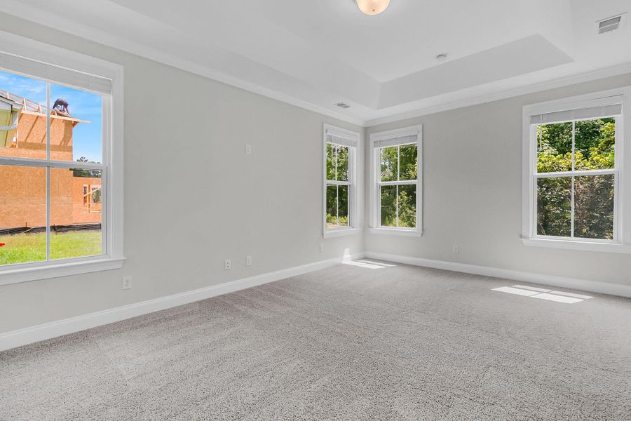 Spacious, unfurnished interior of a new home in Tidewater at Lakes of Cane Bay, Summerville (Image 22).