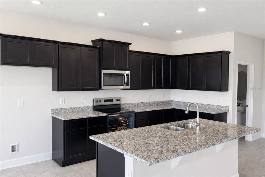 Furnished interior view inside a new home in Harmony Central, Harmony (Image 3).