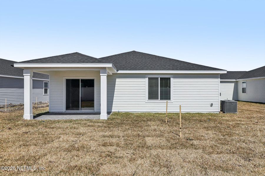 Exterior details and patio area of a home in Colbert Landings, Palm Coast (Image 25).
