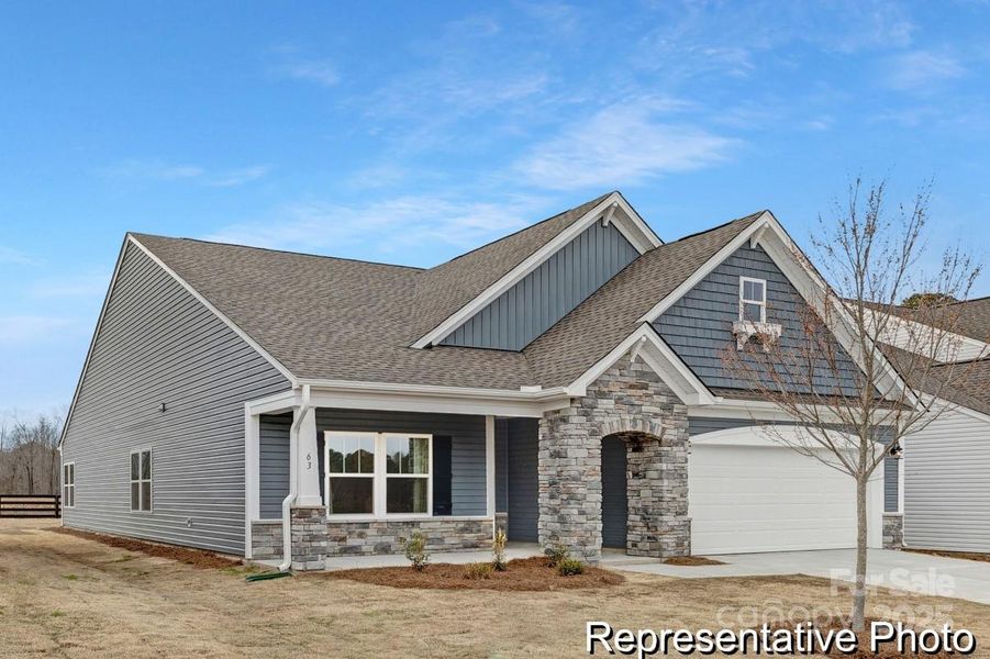 Front exterior of a new home in Whispering Hills, Locust, NC, highlighting curb appeal (Image 2).