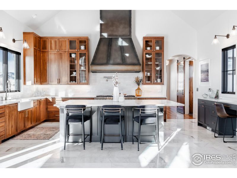 Custom walnut cabinetry, Quartzite countertops and