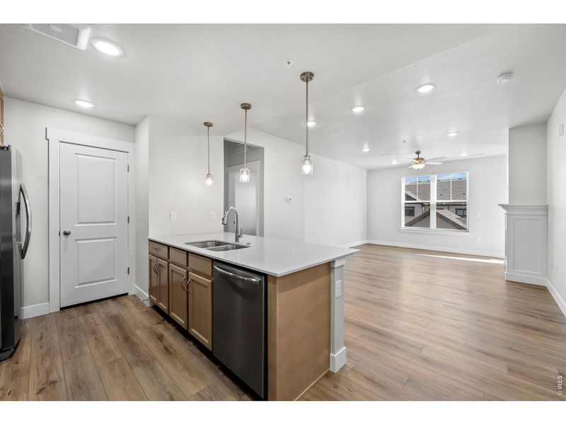 Furnished interior view inside a new home in Highlands at Fox Hill - The Flats, Longmont (Image 3).