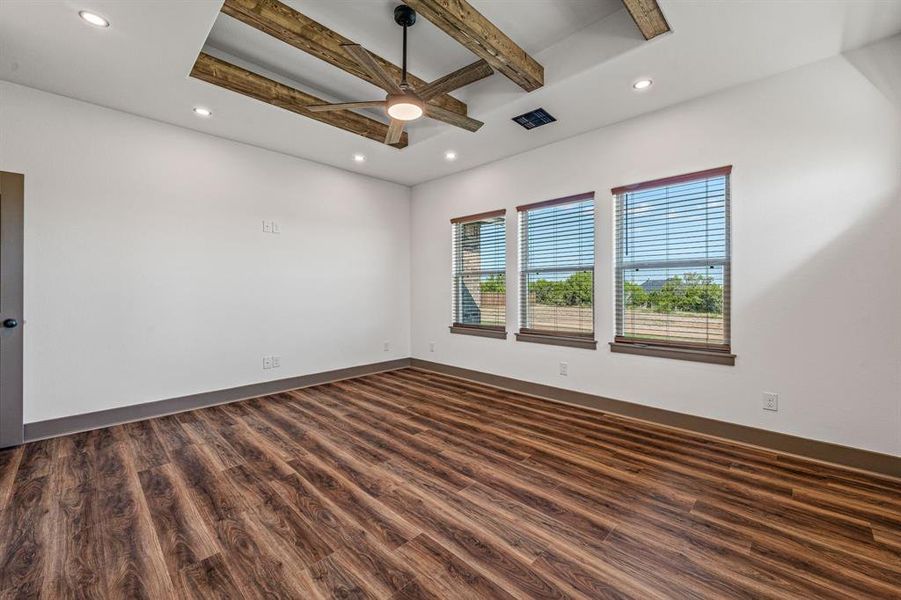 Unfurnished room featuring beam ceiling, dark wood-style flooring, recessed lighting, and a ceiling fan