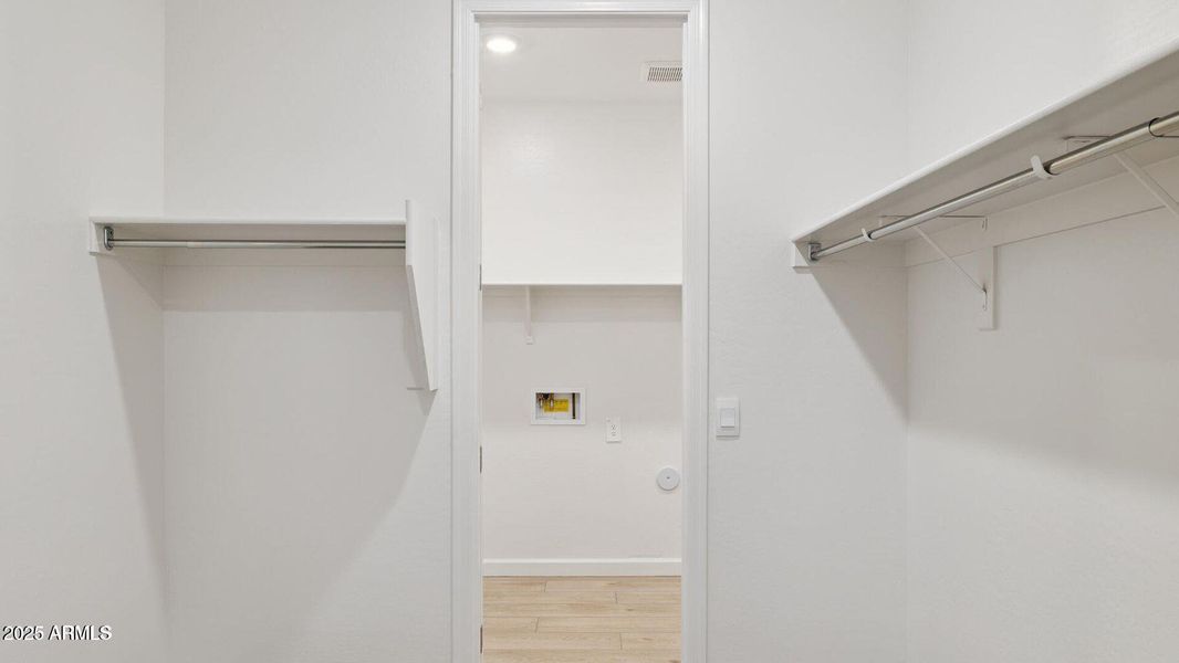 Lot 6 primary closet to laundry Lot 6 primary closet to laundry