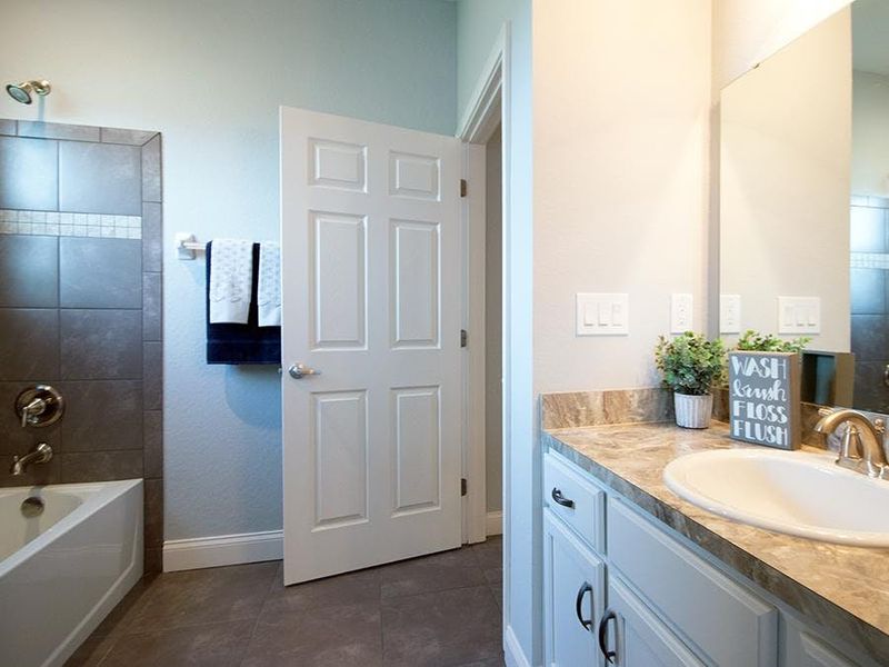 A hall bath serves bedroom 4 and guests - Waylyn by Highland Homes