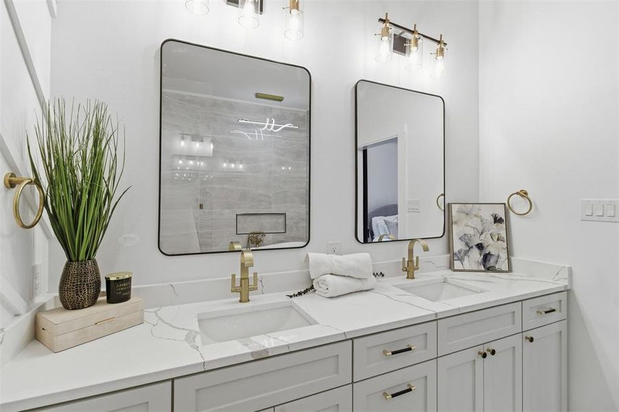 Dual vanity with gold-finish faucets and hardware