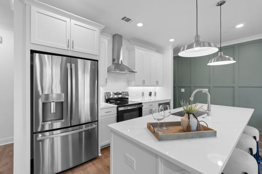 Representative furnished interior of a home built from the The Magnolia by The Providence Group in Market Square at Sawnee Village, Cumming (Image 8).