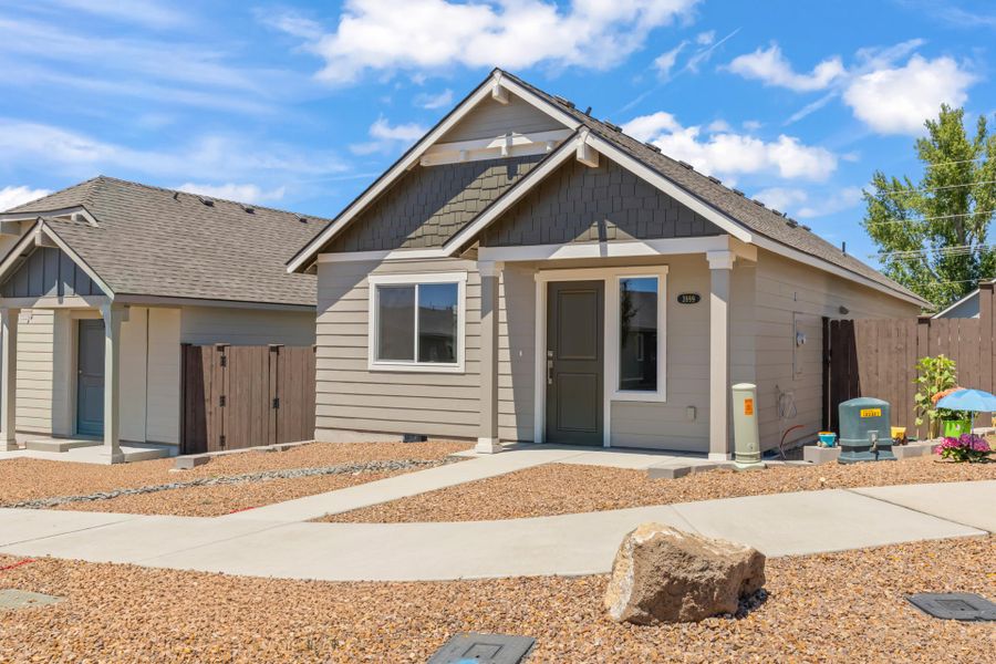 Front exterior of a new home in Feather Ridge, Redmond, OR, highlighting curb appeal (Image 26).