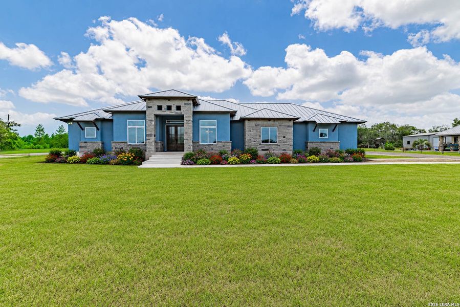 Front exterior of a new home in , Adkins, TX, highlighting curb appeal (Image 32). Front exterior of a new home in , Adkins, TX, highlighting curb appeal (Image 32).