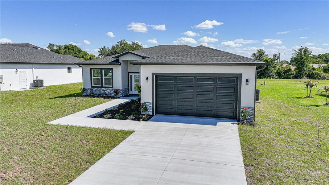 Front exterior of a new home in , Punta Gorda, FL, highlighting curb appeal (Image 25).
