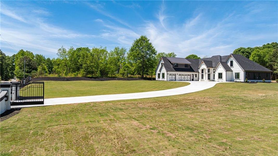 Front exterior of a new home in , Monroe, GA, highlighting curb appeal (Image 34).