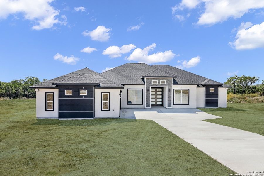 Front exterior of a new home in , Mico, TX, highlighting curb appeal (Image 2). Front exterior of a new home in , Mico, TX, highlighting curb appeal (Image 2).