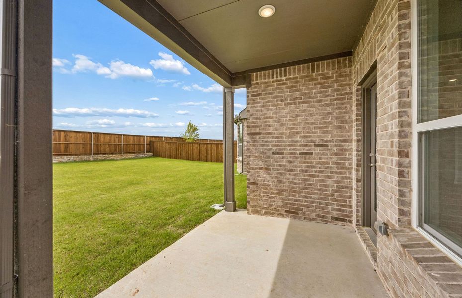 Exterior details and patio area of a home in Creekview Meadows, Pilot Point (Image 3).