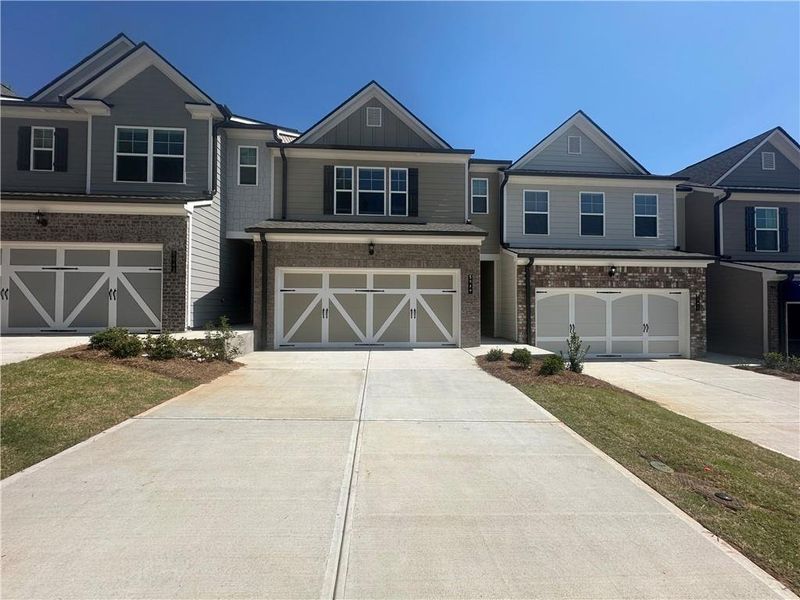 Front exterior of a new home in Mulberry Summit, Flowery Branch, GA, highlighting curb appeal (Image 1).