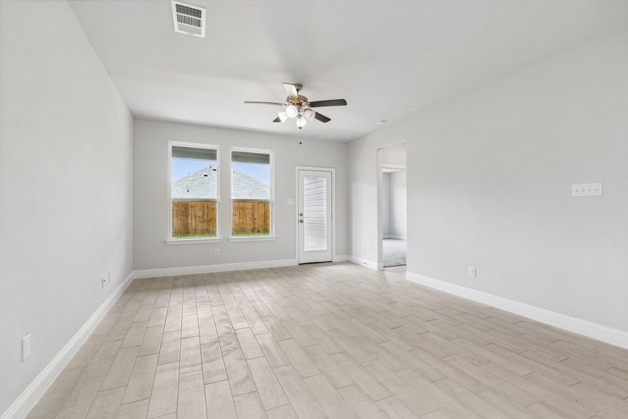 Representative unfurnished interior of a home built from the Lyla by Megatel Homes in Santorini, Seagoville (Image 9).