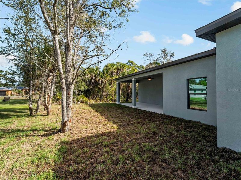 Exterior details and patio area of a home in , North Port (Image 38).