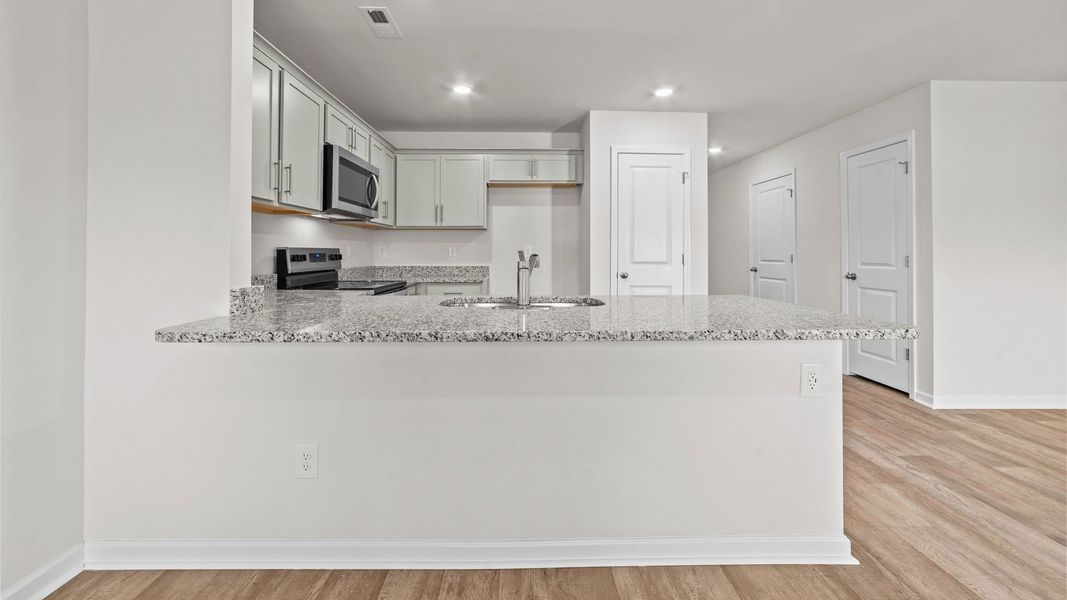 Representative furnished interior of a home built from the Pearson by D.R. Horton in The Townes at Carter Ridge, Greenville (Image 8).