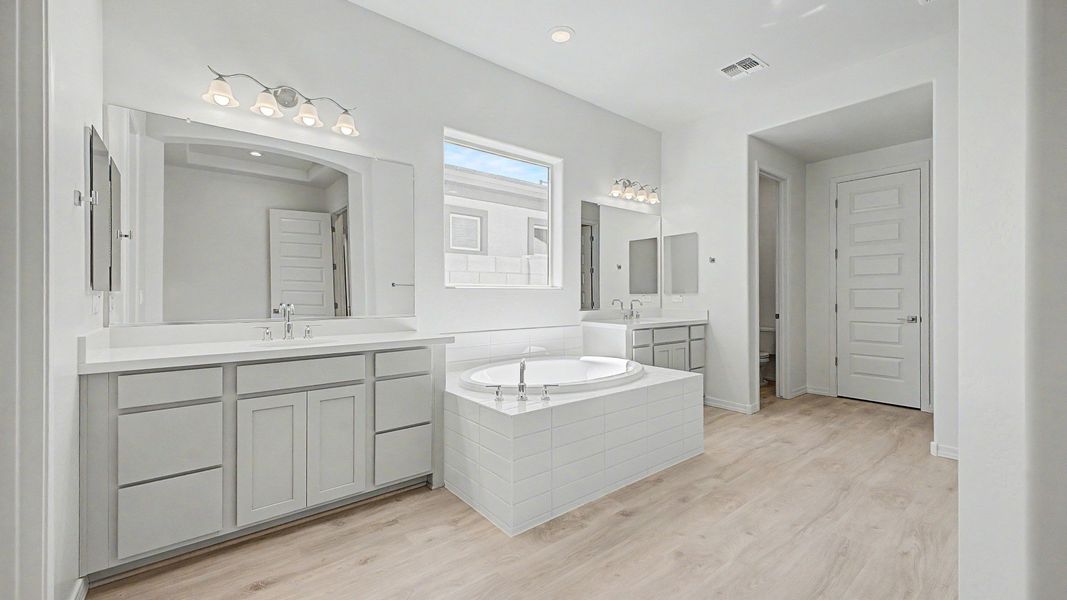 Representative furnished interior of a home built from the Montoro by DRB Homes in Windrose, Waddell (Image 12).