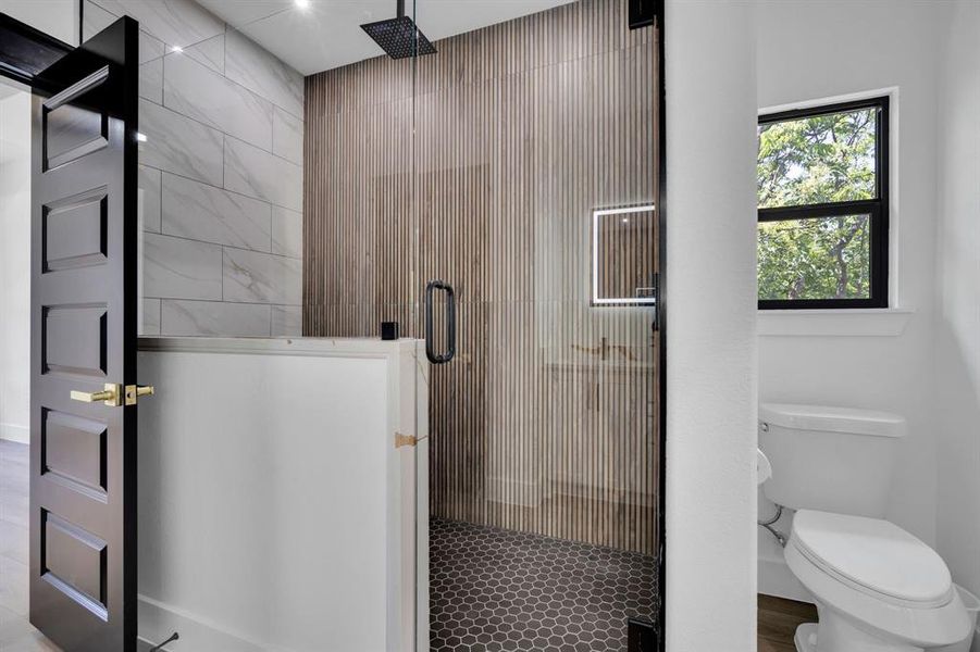 Oversized Shower with lovely tile accents.