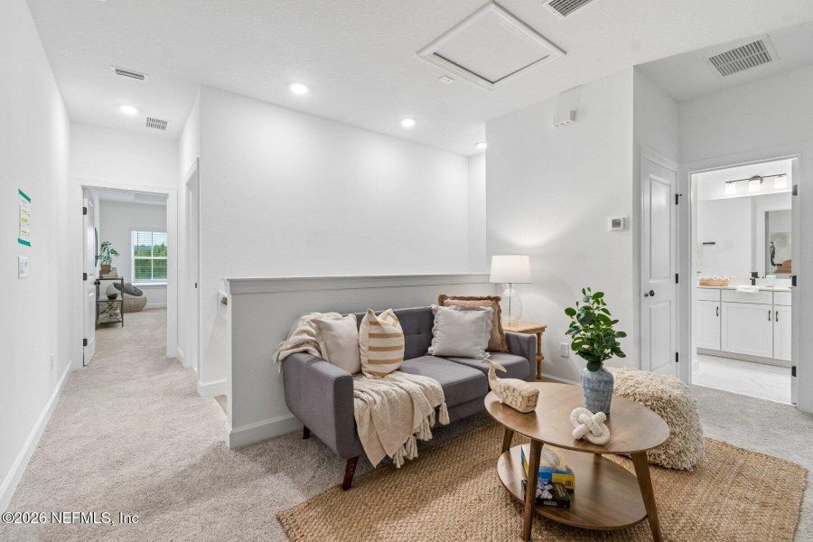 Furnished interior view inside a new home in Westerly Park at Wildlight - Courtyard Collection, Yulee (Image 12).