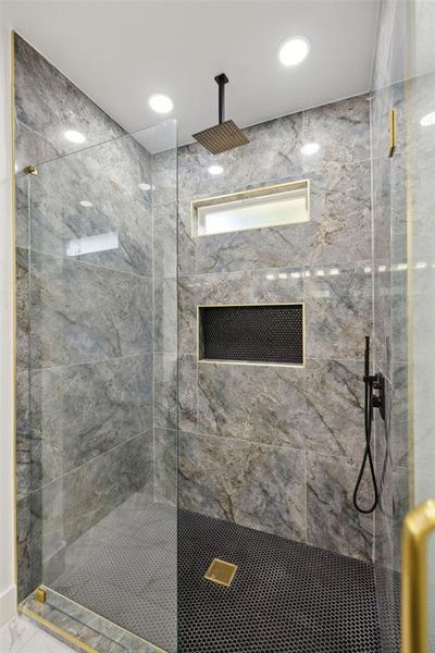 Bathroom featuring tiled shower