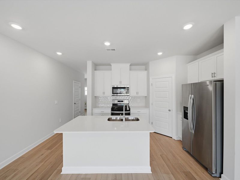 Furnished interior view inside a new home in Crossing at Abner Creek Townes, Greer (Image 5).