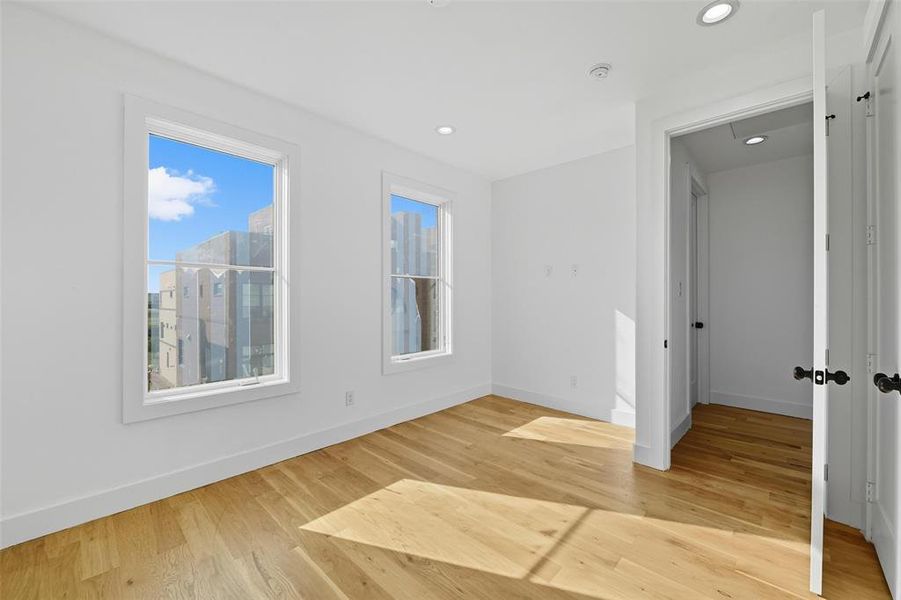 Unfurnished room featuring light wood finished floors and recessed lighting