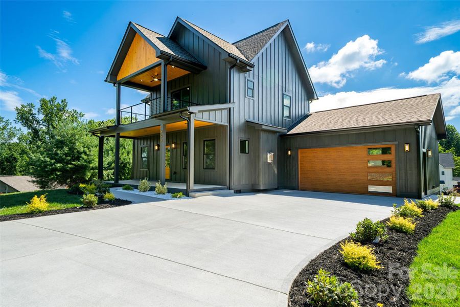 Front exterior of a new home in , Hendersonville, NC, highlighting curb appeal (Image 1). Front exterior of a new home in , Hendersonville, NC, highlighting curb appeal (Image 1).