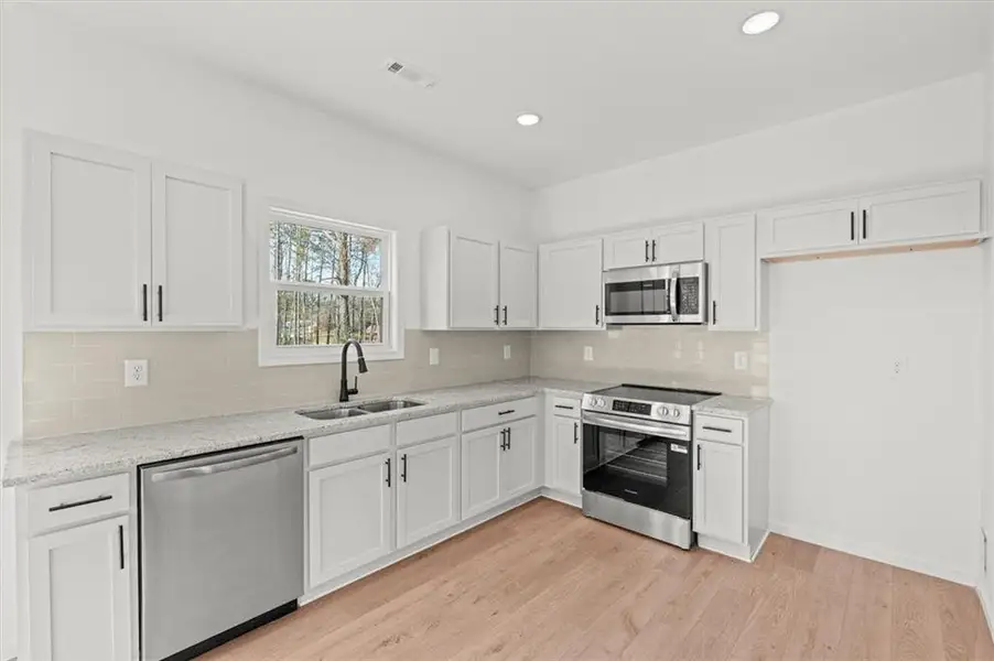 Furnished interior view inside a new home in , Carrollton (Image 3).