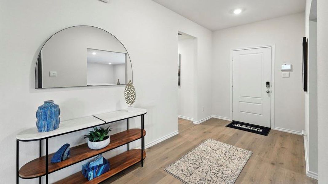 Entryway featuring light wood-style floors and recessed lighting Entryway featuring light wood-style floors and recessed lighting