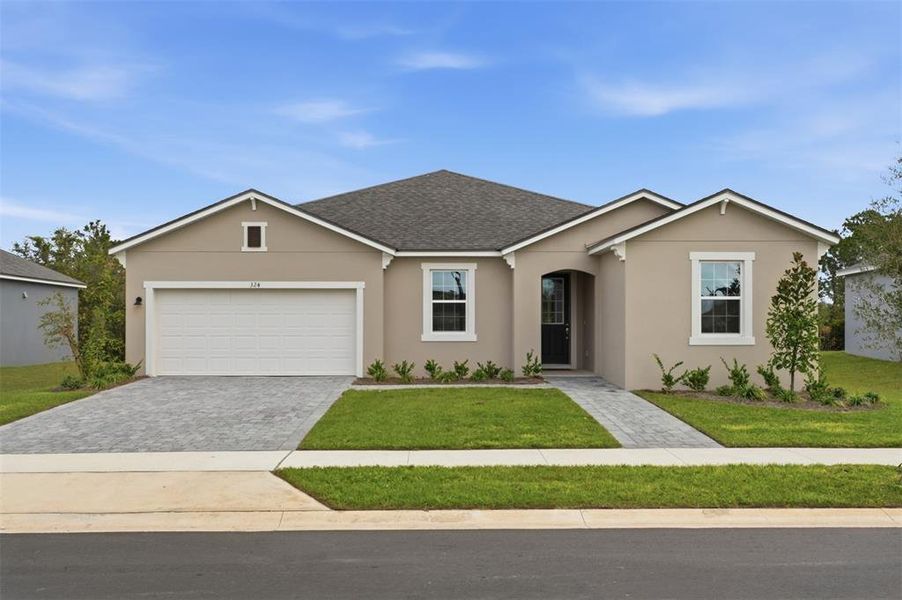 Front exterior of a new home in Rainwood, Groveland, FL, highlighting curb appeal (Image 1). Front exterior of a new home in Rainwood, Groveland, FL, highlighting curb appeal (Image 1).